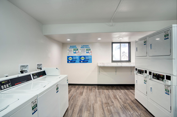 laundry room with washers and dryers at 87 Apartments, Mesa Arizona
